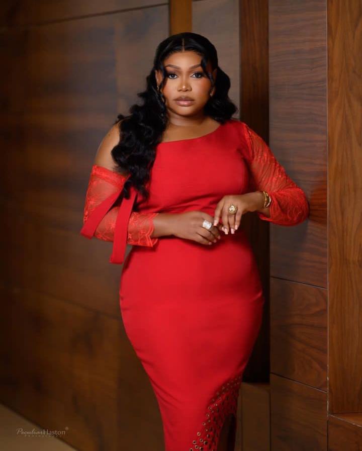 An image of Ruth Kadiri in red