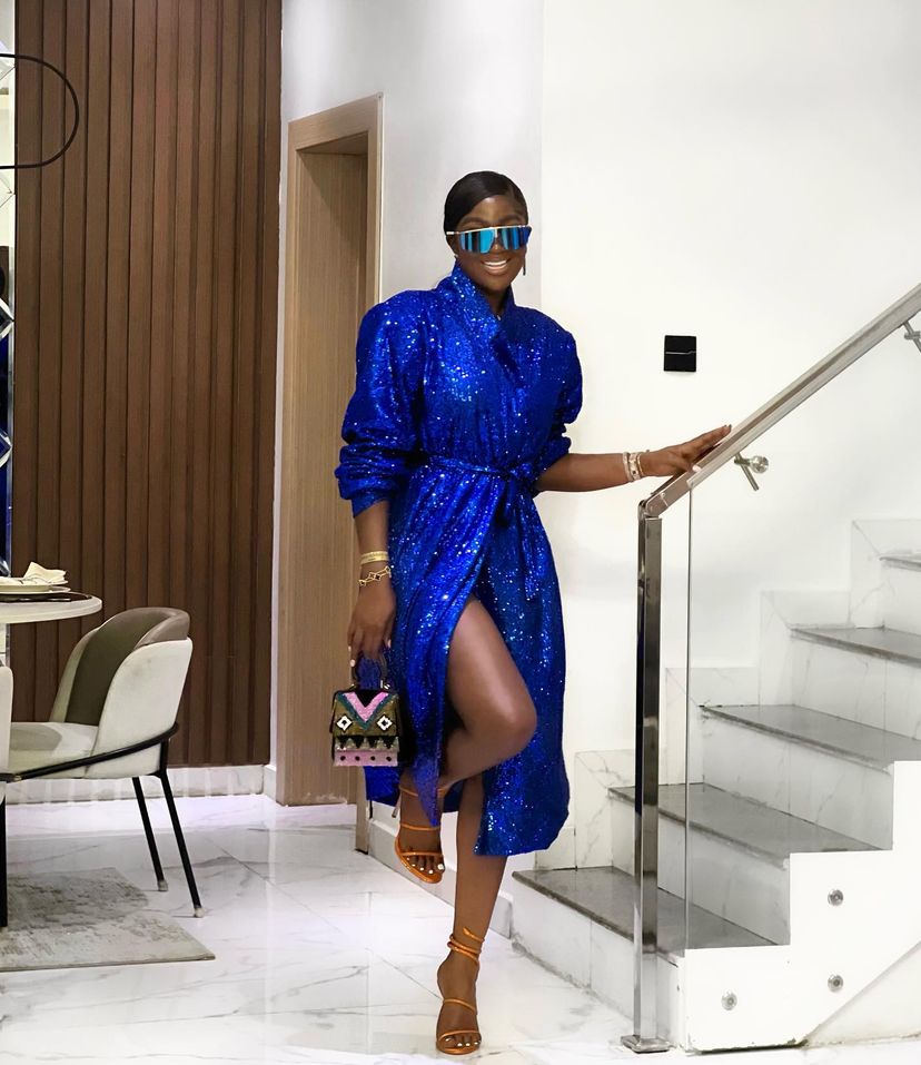 Tolu Bally in a beautiful blue dress