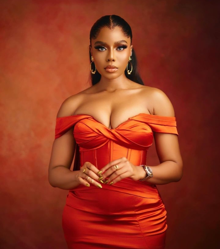 Nancy Isime in an Orange gown