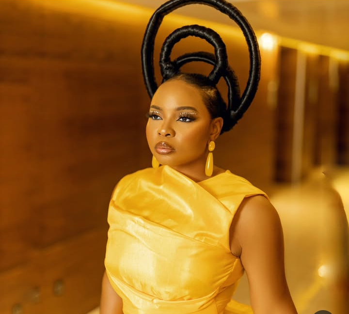 Yemi Alade in a yellow dress