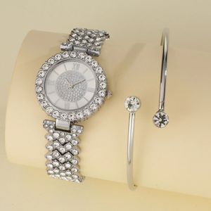 A silver wrist watch and bracelet