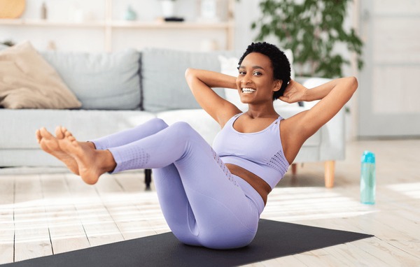 A light skinned lady exercising 