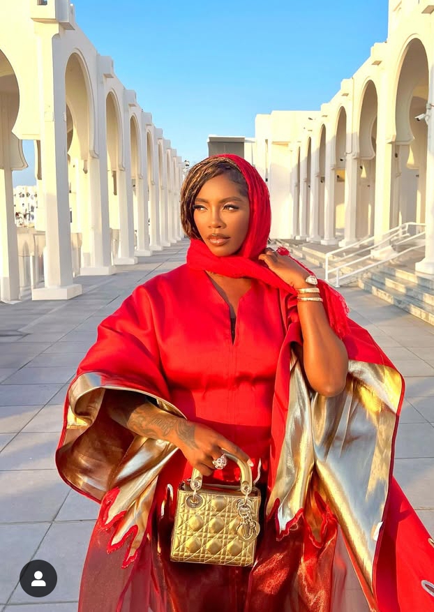 Tiwa Savage rocking a red hot bubu -waist snatched gown 