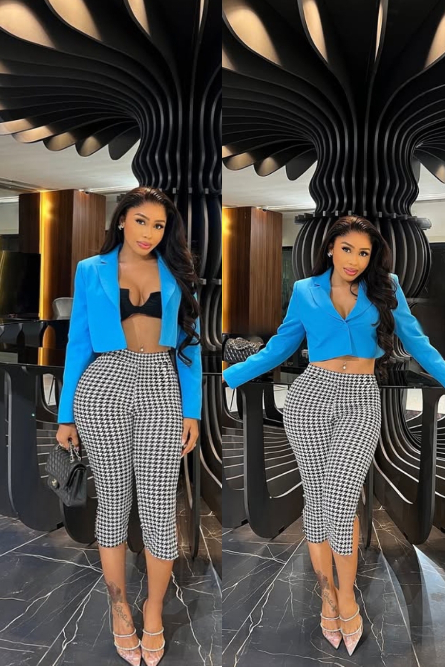 Cynthia Onoriode in a plain blazer and striped 3-quarter pants