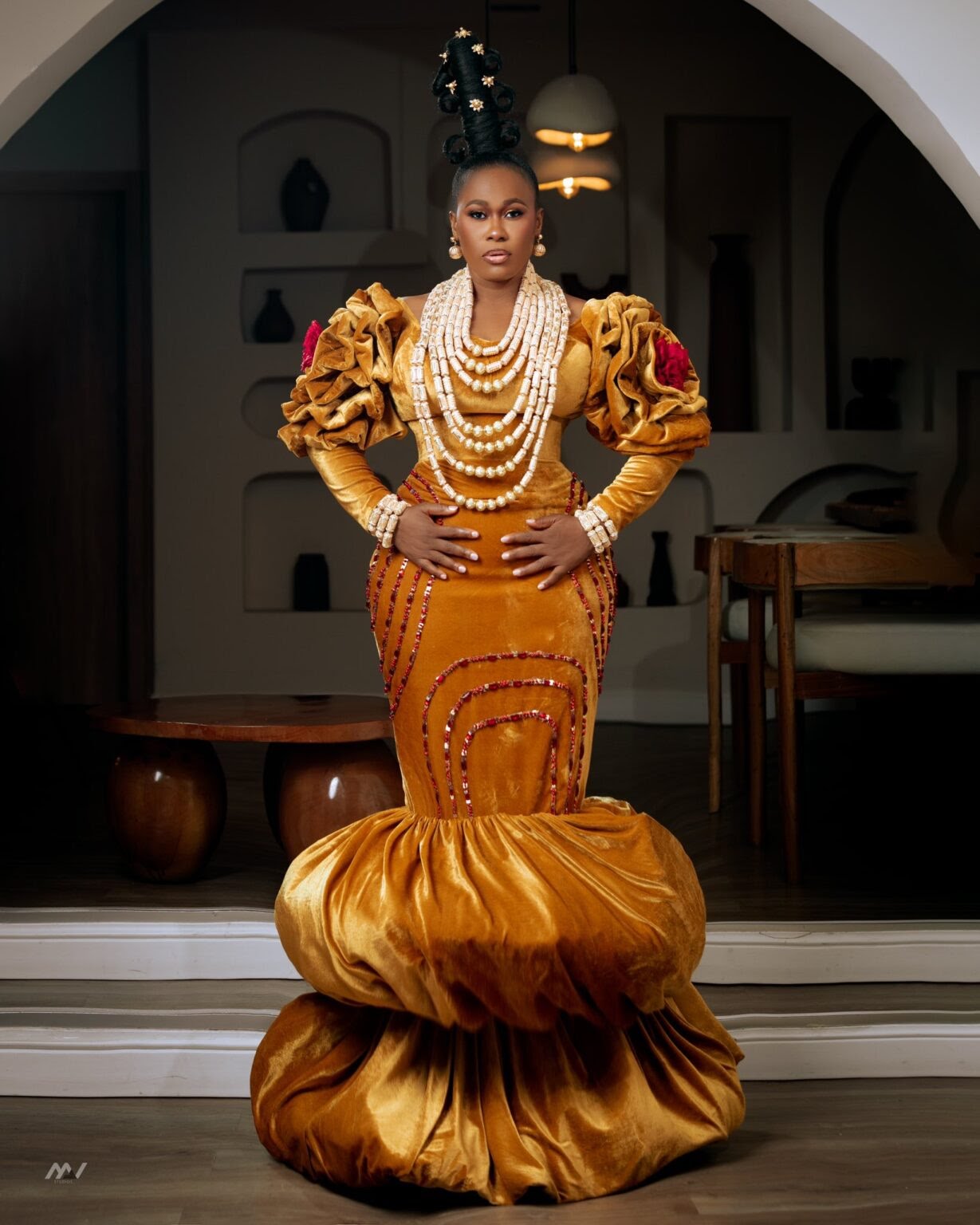 A Nigerian celebrity poses in a stunning traditional outfit at the AMVCA 2025