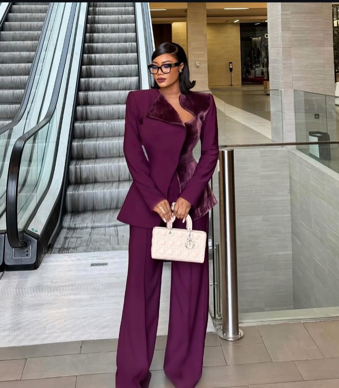 "A stylish Nigerian woman wearing fashionable and professional workwear