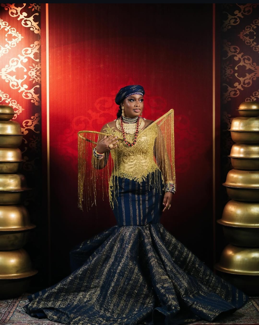 A Nigerian celebrity poses in a stunning traditional outfit at the AMVCA 2025