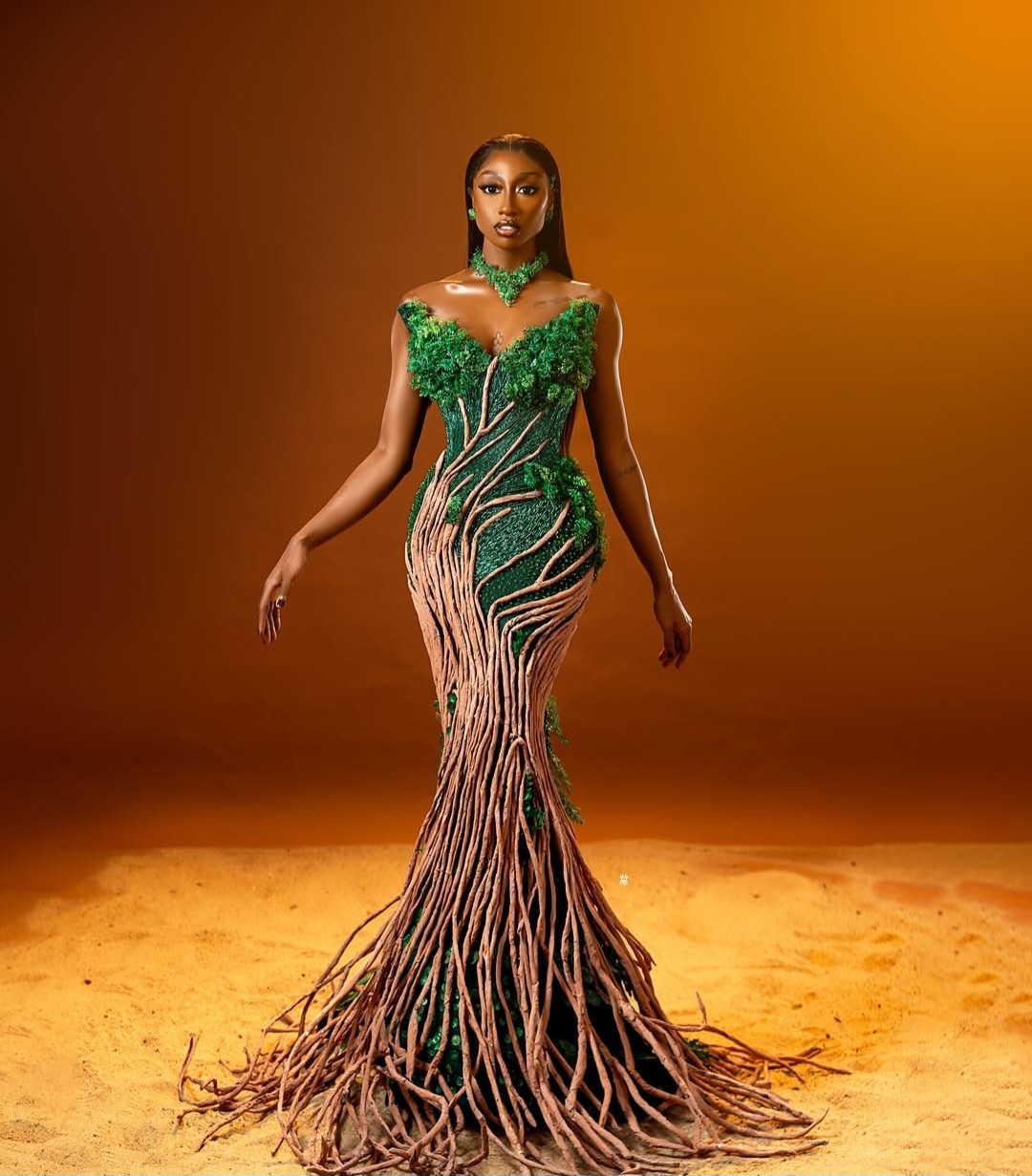 "Nigerian celebrity in a glamorous, custom-made outfit posing on the AMVCA 2025 red carpet