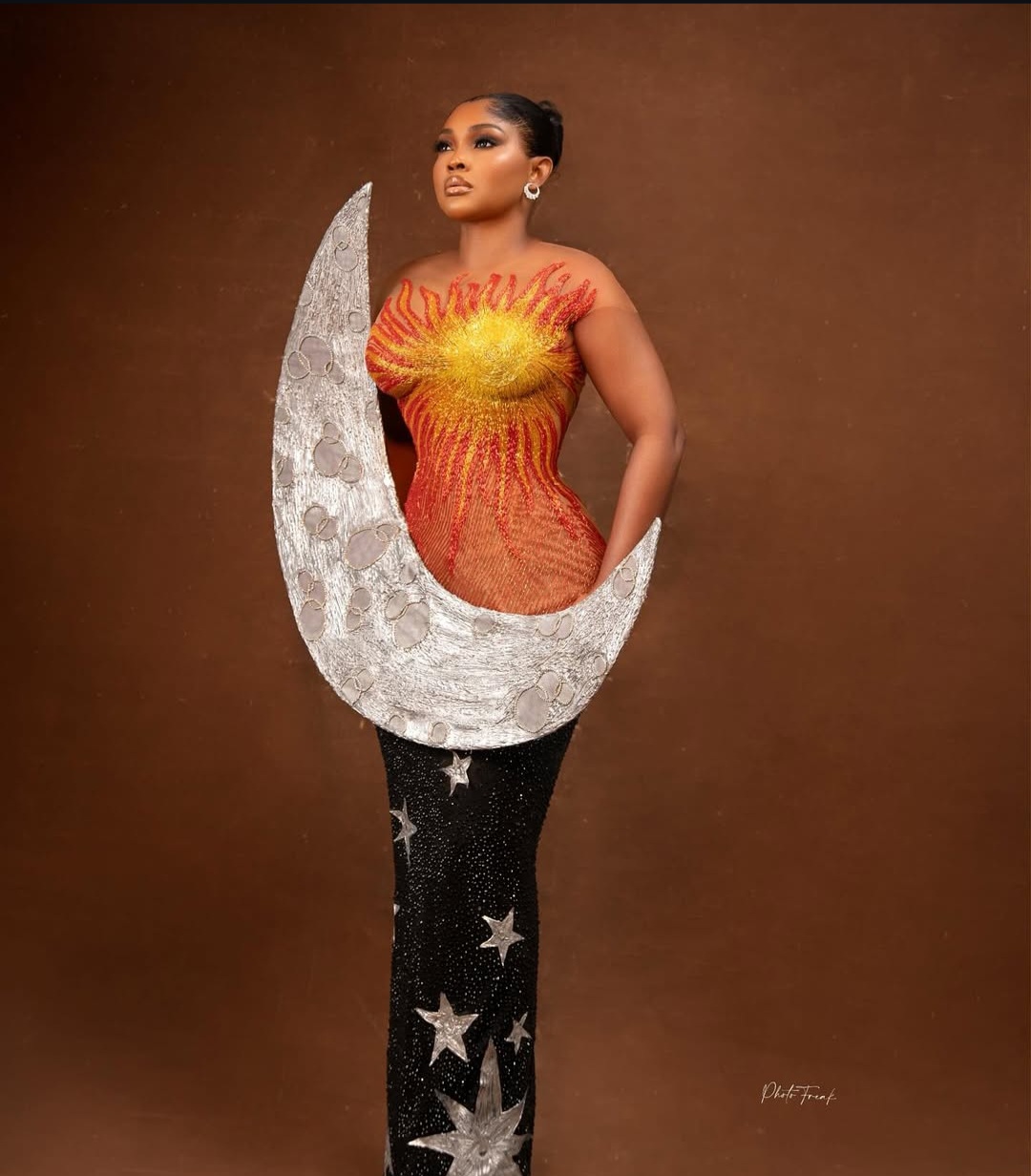 "Nigerian celebrity in a glamorous, custom-made outfit posing on the AMVCA 2025 red carpet