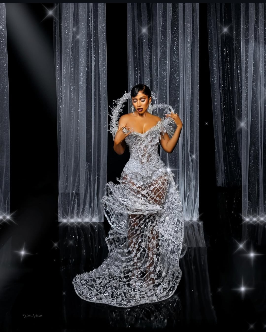 "Nigerian celebrity in a glamorous, custom-made outfit posing on the AMVCA 2025 red carpet