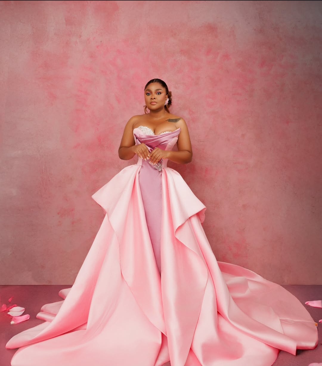 "Nigerian celebrity in a glamorous, custom-made outfit posing on the AMVCA 2025 red carpet