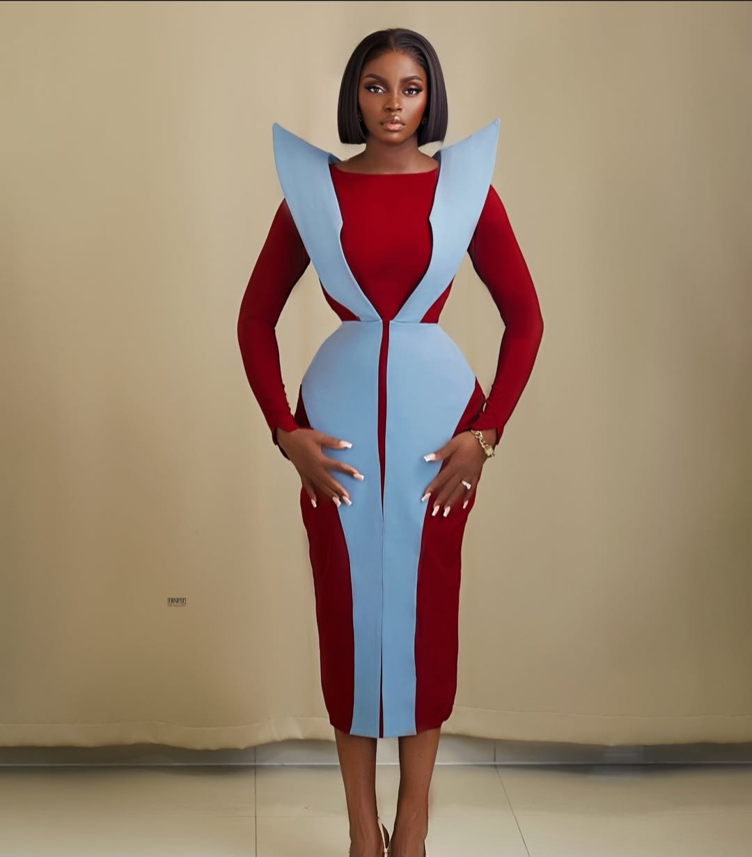 stylish Nigerian fashionista posing in a standout outfit