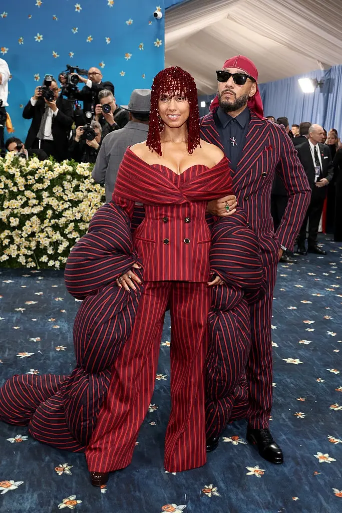 Celebrity Couple Names\] posing together on the 2025 Met Gala red carpet.