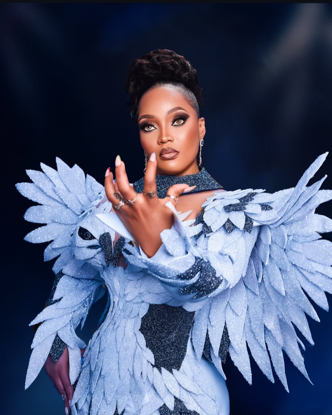 white eagle-inspired dress designed by Tiannah’s Place Empire for influencer Kentazz1
