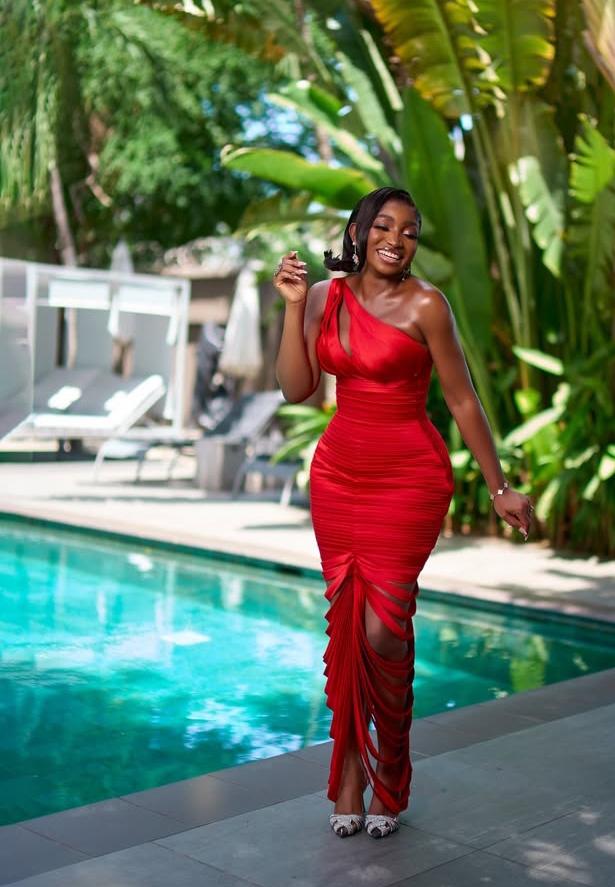 Omawumi Dada in a beautiful red dress