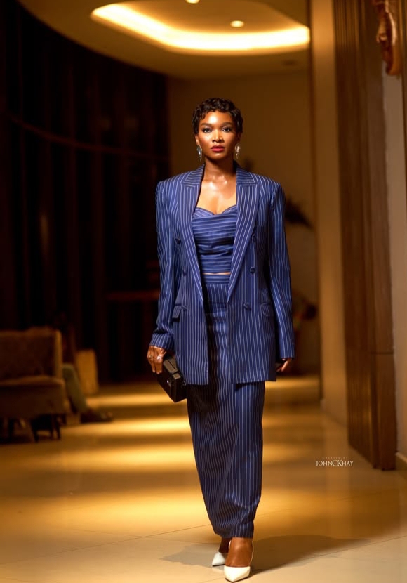 Wofai Fada in her oversized double-breasted navy pinstripe Suit