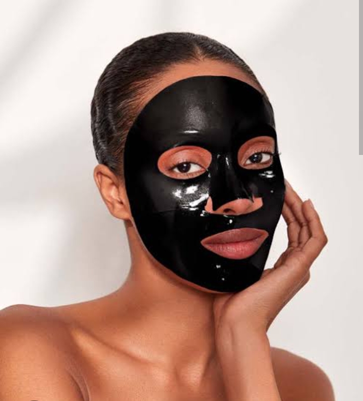 A lady on a black charcoal face masks 